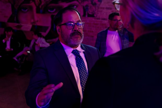 Angel Gutierrez, who won the race for school board in District 8, speaks with people on election night, Nov. 5, 2024, at Moe's Cantina in River North. (Brian Cassella/Chicago Tribune)