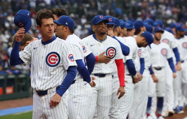 Cubs manager Craig Counsell lines up with the team on April 1, 2024, in the home opener at Wrigley Field. (Brian Cassella/Chicago Tribune)