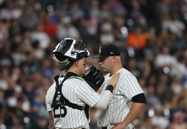 White Sox catcher Korey Lee, left, talks with relief pitcher Jared Shuster before Shuster is taken out of the game in the ninth inning against the Tigers at Guaranteed Rate Field on Aug. 23, 2024. (John J. Kim/Chicago Tribune)