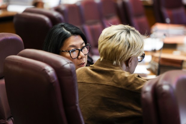 Ald. Nicole Lee, 11th, left, speaks to Ald. Pat Dowell, 3rd, during a 2025 budget hearing at City Hall, Dec. 3, 2024. (Eileen T. Meslar/Chicago Tribune)