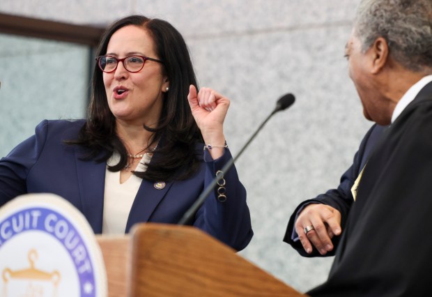 Chief Judge Timothy Evans ceremoniously swears in new Cook County Circuit Court Clerk Mariyana Spyropoulos at the Daley Center, Dec. 2, 2024. (Eileen T. Meslar/Chicago Tribune)