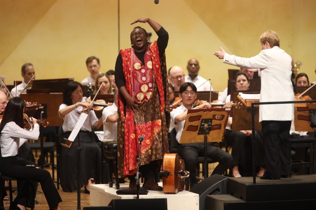 Abel Selaocoe preforms "MaSebego" the first movement of "Four Spirits" during night two of the Chicago Symphony Orchestra's residency at Ravinia Festival in Highland Park on Saturday, July 13, 2024. (Trent Sprague/for the Chicago Tribune)