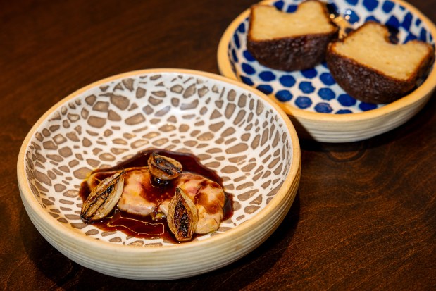 Foie gras with canelé on the side, at right, at Feld restaurant. (Tess Crowley/Chicago Tribune)