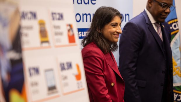 Federal Trade Commission Chair Lina M. Khan smiles after speaking Dec. 17, 2024, at a Chicago news conference where the FTC announced action against Grubhub. Illinois Attorney General Kwame Raoul is at right. (Tess Crowley/Chicago Tribune)