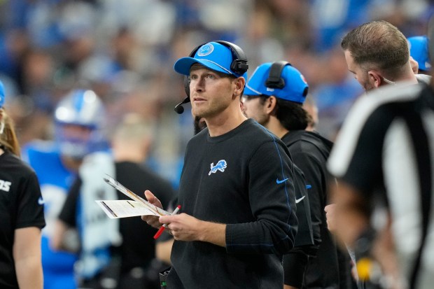 Lions offensive coordinator Ben Johnson watches from the sideline on Dec. 6, 2024, in Detroit. (Carlos Osorio/AP)