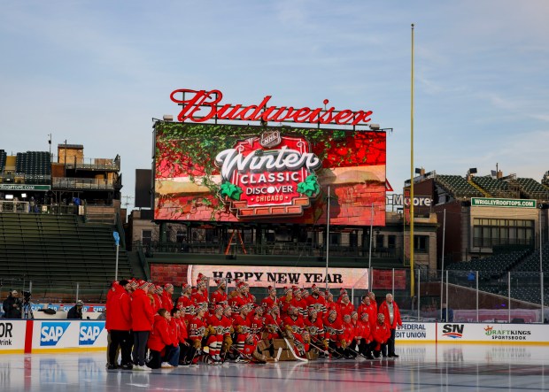 The Chicago Blackhawks take a team photo before practicing on the ice Monday, Dec. 30, 2024, before facing the St. Louis Blues in the NHL Winter Classic at Wrigley Field. (Brian Cassella/Chicago Tribune)