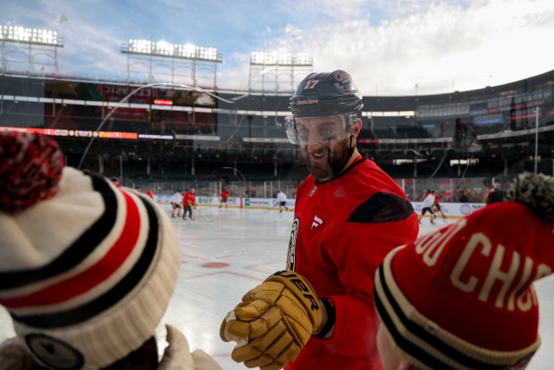 Chicago Blackhawks left wing Nick Foligno greets people during practice on the ice Monday, Dec. 30, 2024, before facing the St. Louis Blues in the NHL Winter Classic at Wrigley Field. (Brian Cassella/Chicago Tribune)