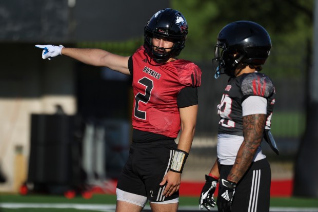 Northern Illinois quarterback Ethan Hampton speaks to a teammate during practice on Tuesday, Sept. 17, 2024, at Huskie Stadium in DeKalb, Ill. (Eileen T. Meslar/Chicago Tribune)