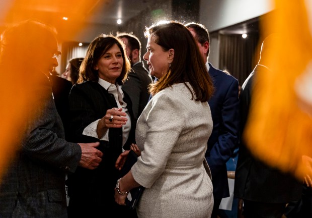 Eileen O'Neill Burke, right, greets people after being ceremoniously sworn in as the new Cook County state's attorney on Dec. 2, 2024, at the Ivy Room in River North. (Brian Cassella/Chicago Tribune)