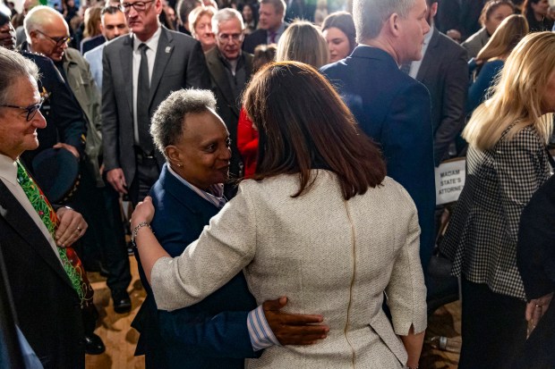 Eileen O'Neill Burke greets former Mayor Lori Lightfoot after being sworn in as the new Cook County state's attorney on Dec. 2, 2024, at the Ivy Room in River North. (Brian Cassella/Chicago Tribune)