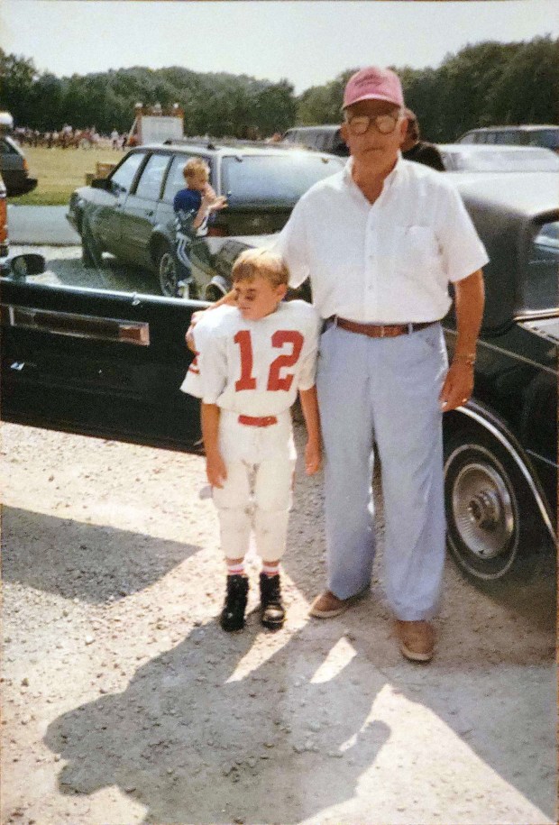 Edward Gorski, a World War II veteran who earned a Purple Heart, with his grandson, Shawn, at the 7-year-old boy's football game in 1992. (Lora Oldham)