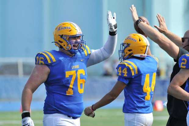 Lyons offensive lineman Tyler Chambers (76) celebrates during a West Suburban Silver game against Glenbard West on Sept. 21, 2024, in Western Springs. (Patrick Gorski/For Pioneer Press)