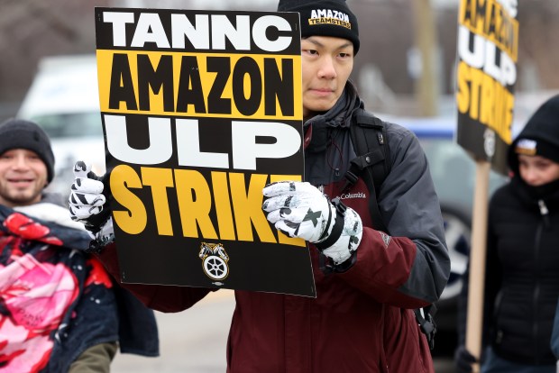 Amazon workers strike outside the facility in Skokie on Dec. 19, 2024. (Antonio Perez/Chicago Tribune)