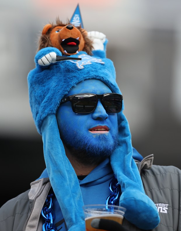 A Detroit Lions fan takes in the scene as players warm up for a game against the Bears at Soldier Field on Dec. 22, 2024. (Chris Sweda/Chicago Tribune)