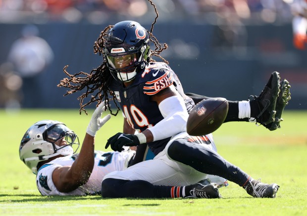 Bears linebacker Tremaine Edmunds keeps his eyes on the ball after forcing a fumble from Panthers running back Chuba Hubbard in the fourth quarter at Soldier Field on Oct. 6, 2024. (Chris Sweda/Chicago Tribune)