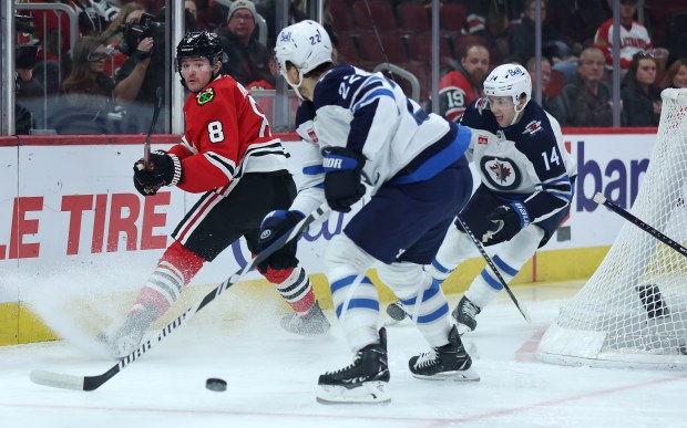 Chicago Blackhawks center Ryan Donato (8) makes a pass in the first period of a game against the Winnipeg Jets at the United Center in Chicago on Dec. 7, 2024. (Chris Sweda/Chicago Tribune)