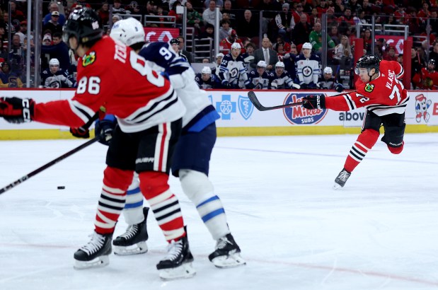 Chicago Blackhawks defenseman Alex Vlasic (72) shoots and scores a goal in the first period of a game against the Winnipeg Jets at the United Center in Chicago on Dec. 7, 2024. (Chris Sweda/Chicago Tribune)