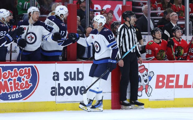 Winnipeg Jets center Gabriel Vilardi (13) is congratulated by his teammates after scoring a goal in the first period of a game against the Chicago Blackhawks at the United Center in Chicago on Dec. 7, 2024. (Chris Sweda/Chicago Tribune)