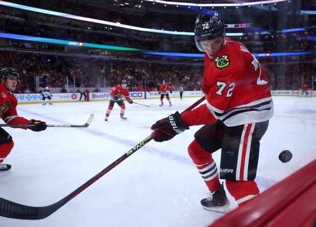 Chicago Blackhawks defenseman Alex Vlasic (72) keeps his eyes on the puck along the boards in the second period of a game against the Winnipeg Jets at the United Center in Chicago on Dec. 7, 2024. (Chris Sweda/Chicago Tribune)