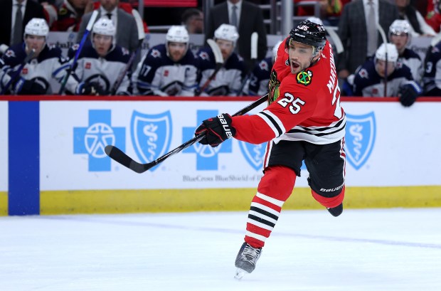 Chicago Blackhawks defenseman Alec Martinez (25) takes a shot on goal in the first period of a game against the Winnipeg Jets at the United Center in Chicago on Dec. 7, 2024. (Chris Sweda/Chicago Tribune)