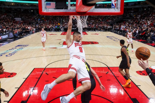 Chicago Bulls center Nikola Vucevic (9) dunks the ball during the first half against the Utah Jazz at the United Center on Nov. 4, 2024. (Armando L. Sanchez/Chicago Tribune)