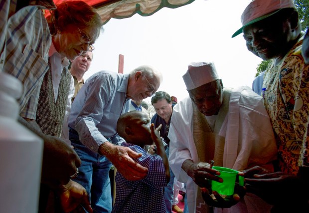 Former President Jimmy Carter and former first lady Rosalyn Carter help administer praziquantel pills for Schistosomiasis in Nigeria on Feb. 15, 2007. A single dose can reverse up to 90 percent of schistosomiasis' damage within six months. Schistosomiasis, also known as snail fever, is a plague-like intestinal disease. The Carter Center, instrumental in battling the Guinea worm and other neglected diseases across the globe, also launched a campaign against schistosomiasis. (Wes Pope/Chicago Tribune)