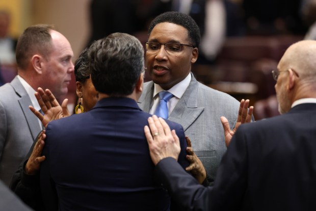 Ald. Jason Ervin and Ald. Scott Waguespack, back to camera, confront each other after a recess was called following an argument over a motion as the Chicago City Council meets for a procedural vote on Mayor Brandon Johnson's 2025 budget at City Hall, on Dec. 11, 2024. (Antonio Perez/Chicago Tribune)