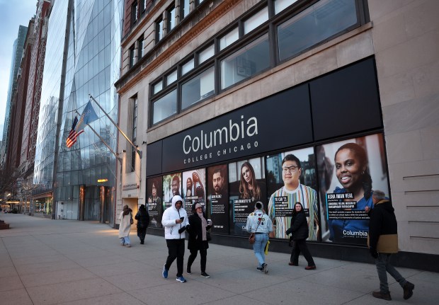 People pass by Columbia College Chicago's building in the South Loop, 600 S. Michigan Ave., on Dec. 13, 2024. The school plans to cut 12 undergraduate and graduate programs and eliminate about 30 faculty positions next academic year. (Chris Sweda/Chicago Tribune)