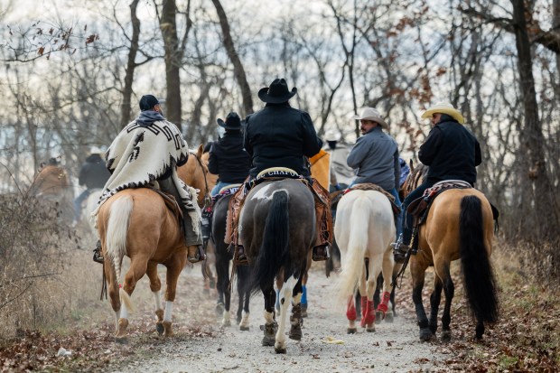 Club Los Vaqueros Unidos riders begin the horseback pilgrimage to the Shrine of Our Lady of Guadalupe on Dec. 7, 2024. (Tess Crowley/Chicago Tribune)