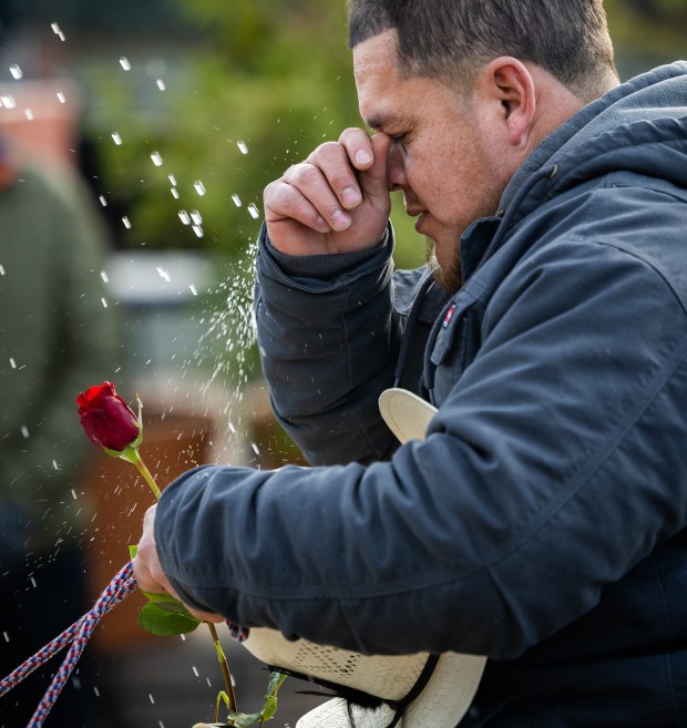 A horseback rider from Club Los Vaqueros Unidos is sprayed with holy water after the pilgrimage to the Shrine of Our Lady of Guadalupe in Des Plaines on Dec. 7, 2024. (Tess Crowley/Chicago Tribune)