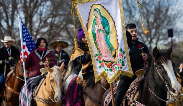 Riders from Club Los Vaqueros Unidos arrive at the Shrine of Our Lady of Guadalupe in Des Plaines on Dec. 7, 2024. (Tess Crowley/Chicago Tribune)