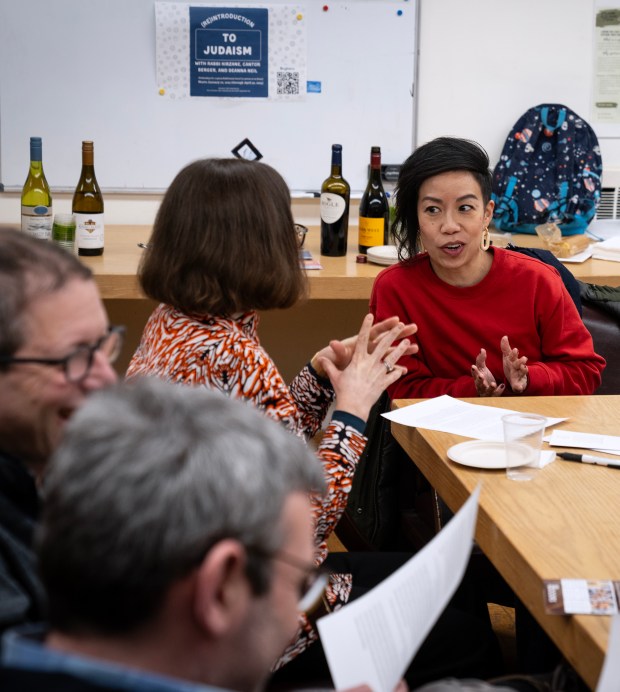 Lynette Li Rappaport chats during an exercise at a workshop for mixed-faith Jewish families about navigating different traditions during holiday celebrations, at KAM Isaiah Israel Congregation on Dec. 13, 2024. (E. Jason Wambsgans/Chicago Tribune)