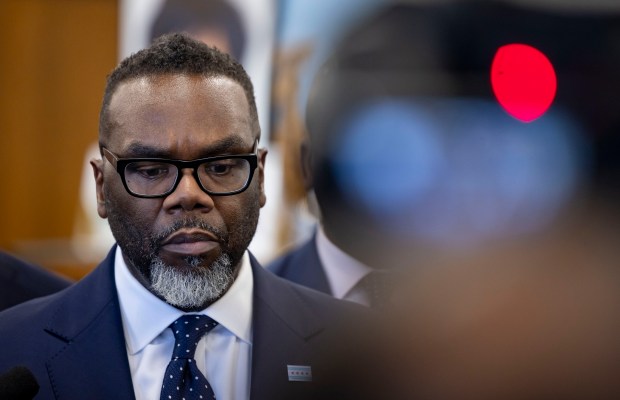 Mayor Brandon Johnson takes questions from reporters after announcing the new Office of Re-Entry on Dec. 5, 2024, at Teamwork Englewood. (Brian Cassella/Chicago Tribune)