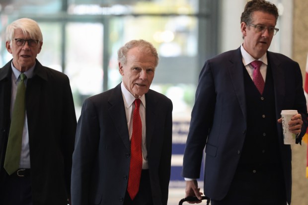 Former House Speaker Michael Madigan, center, exits after attending his corruption trial at the Dirksen U.S. Courthouse on Nov. 20, 2024. (John J. Kim/Chicago Tribune)