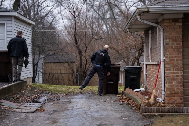 Law enforcement investigate the scene, Dec. 27, 2024, where two women were discovered shot Thursday night in a home on the 300 block of Miami Street in Park Forest. (E. Jason Wambsgans/Chicago Tribune)