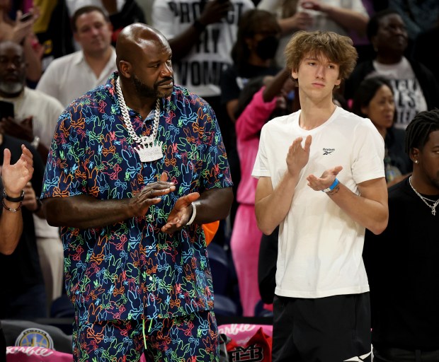 Former NBA player Shaquille O'Neal and Chicago Bulls player Matas Buzelis stand beside one another before the start of a game between the Chicago Sky and the Indiana Fever at Wintrust Arena in Chicago on Aug. 30, 2024. (Chris Sweda/Chicago Tribune)