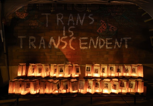 Luminaria display pictures of victims of fatal violence during a Transgender Day of Remembrance observance outside the office of Chicago Therapy Collective in Chicago's Andersonville neighborhood, Nov. 20, 2024. (John J. Kim/Chicago Tribune)