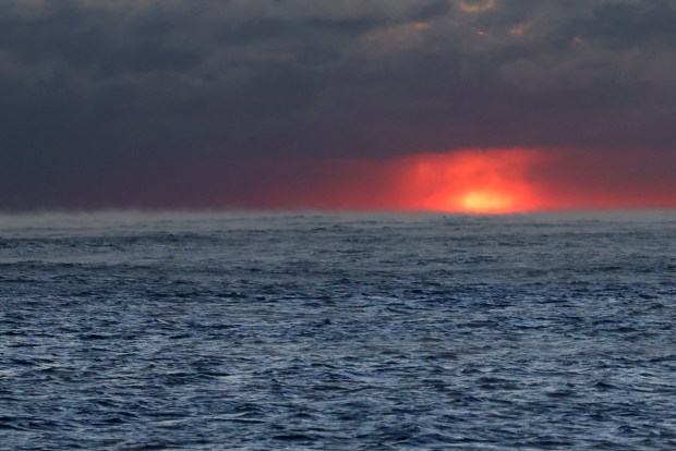 The sun rises over Lake Michigan in Chicago on Dec. 12, 2024. (Antonio Perez/Chicago Tribune)