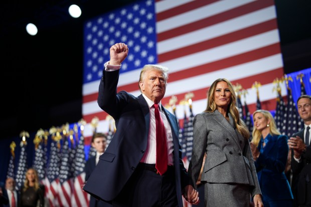 Former President Donald Trump walks off stage with Melania Trump during an election night event in West Palm Beach, Fla., Nov. 6, 2024. (Doug Mills/The New York Times)