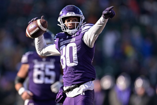 Hayden Eligon II #80 of the Northwestern Wildcats reacts after a first down in the second half against the Illinois Fighting Illini at Wrigley Field on Nov. 30, 2024 in Chicago, Illinois. (Photo by Quinn Harris/Getty Images)