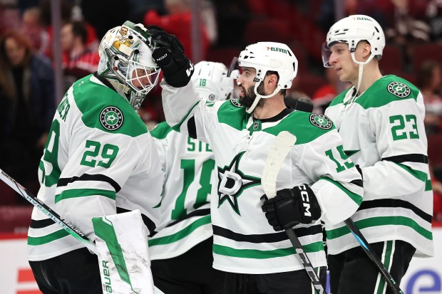 Jake Oettinger #29 and Colin Blackwell #15 of the Dallas Stars celebrate after defeating the Chicago Blackhawks at the United Center on Dec. 29, 2024 in Chicago, Illinois. (Photo by Michael Reaves/Getty Images)