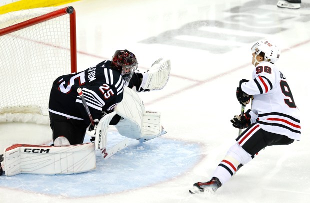 Blackhawks center Connor Bedard hits the post with a shot behind Devils goaltender Jacob Markstrom during the third period on Dec. 14, 2024, in Newark, N.J. (Noah K. Murray/AP)