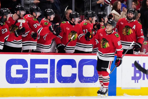 Chicago Blackhawks center Teuvo Teravainen (86) celebrates with teammates after scoring during the second period of an NHL hockey game against the New York Islanders in Chicago, Sunday, Dec. 15, 2024. (AP Photo/Nam Y. Huh)