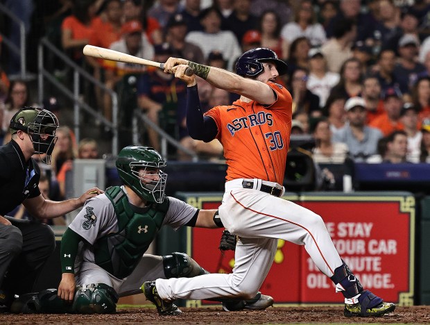 Astros slugger Kyle Tucker hits an RBI double against the Athletics on May 19, 2023, at Minute Maid Park in Houston. (Bob Levey/Getty)