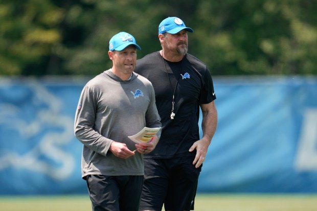 Detroit Lions offensive coordinator Ben Johnson, left, and head coach Dan Campbell watch during an NFL football practice in Allen Park, Mich., Thursday, June 8, 2023. (AP Photo/Paul Sancya)