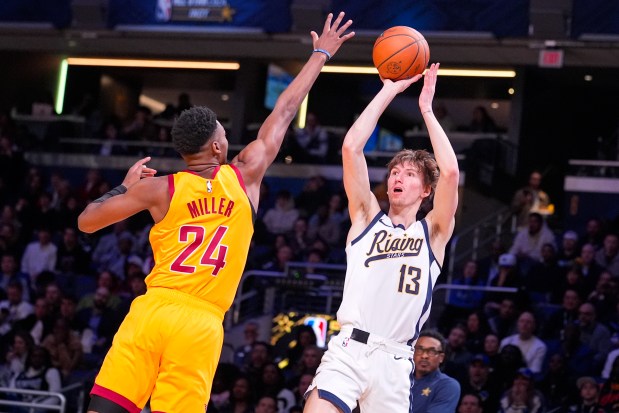 Matas Buzelis, right, of the G League Ignite, shoots over the Hornets' Brandon Miller during the NBA Rising Stars game on Feb. 16, 2024, in Indianapolis. (Michael Conroy/AP)