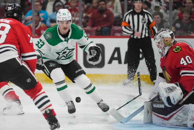 Dallas Stars center Wyatt Johnston breaks and loses his stick as he scores on Chicago Blackhawks goaltender Arvid Soderblom during the third period of an NHL hockey game Sunday, Dec. 29, 2024, in Chicago. (AP Photo/Erin Hooley)