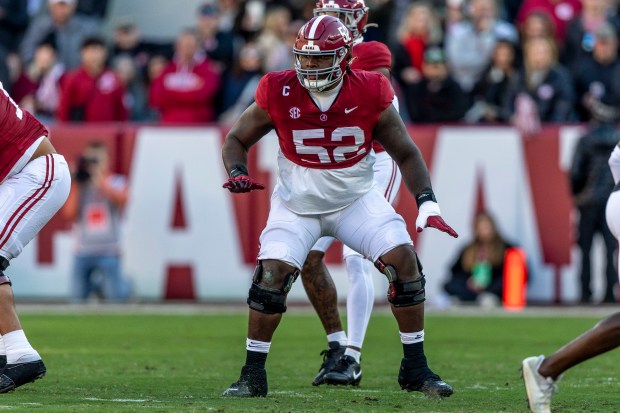 Alabama guard Tyler Booker (52) looks for a block against Auburn on Nov. 30, 2024, in Tuscaloosa, Ala. (Vasha Hunt/AP)