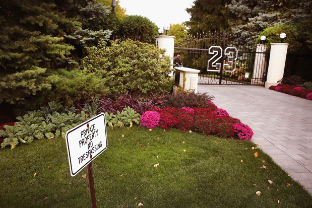 A gate with the number 23 controls access to the home of basketball legend Michael Jordan on Oct. 21, 2013, in Highland Park, Illinois. Twenty-three is the number Jordan wore while playing basketball for the Chicago Bulls. The 32,683-square-foot home features nine bedrooms, 19 bathrooms, a 15-car attached garage and an "NBA-quality" basketball court. (Scott Olson/Getty Images/TNS)