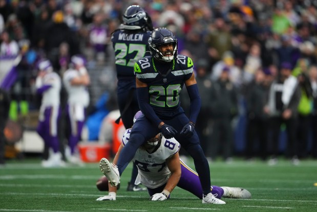 Seattle Seahawks safety Julian Love reacts to tackling Minnesota Vikings tight end T.J. Hockenson during an NFL football game Sunday, Dec. 22, 2024, in Seattle. (AP Photo/Lindsey Wasson)